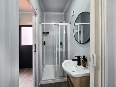a bathroom with a sink and a mirror at Beds Inn Midrand in Midrand