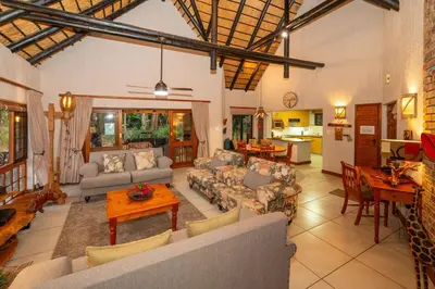 a large living room with couches and a table at Kruger Park Lodge Unit No 304 in Hazyview