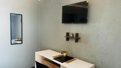 a room with a mirror and a white table at Mahlako Guest Lodge in Polokwane