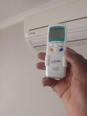 a person holding a electronic device in their hand at Jakaranda house in Pretoria