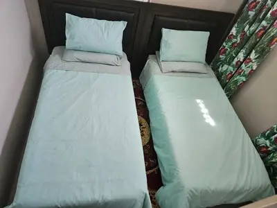 two beds sitting next to each other in a room at Luxury Meets Convenience Near City & Travel Links in Pretoria