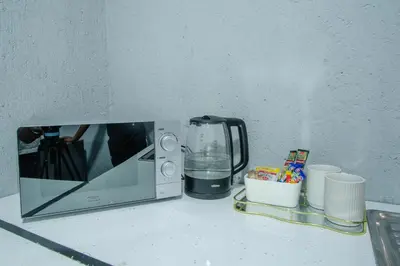 a microwave sitting on top of a counter at Unit 5 and 6 Homely Escapes in Phalaborwa