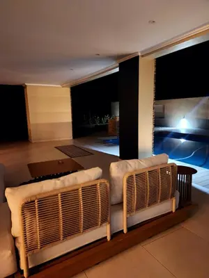 a living room with a couch and a table at Euphoria 447 in Naboomspruit