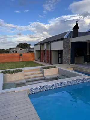 a house with a swimming pool in front of a house at Euphoria 447 in Naboomspruit