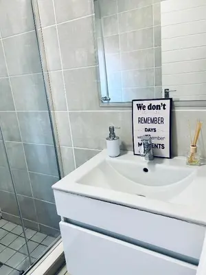 a bathroom sink with a sign that says we dont remember days at The Blyde bnb in Pretoria