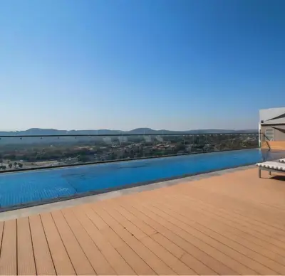 a view from the roof of a house with a swimming pool at Luxurious and Modern, Menlyn Maine Residences 825 in Pretoria