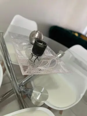 a glass table with a silver object on top of it at The Blyde - Stay Iconic 2 bed Apartment in Pretoria