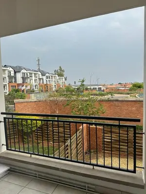 a balcony with a view of a building at The Blyde - Stay Iconic 2 bed Apartment in Pretoria