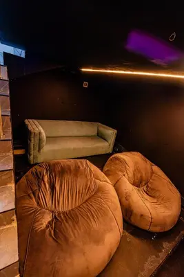 two large bean bags sitting next to a couch at Sucassa 54 - Luxury 2 Bedroom - Dam & Mountain View in Hartbeespoort