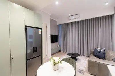 a living room with a couch and a table at 932 menlyn maine in Pretoria