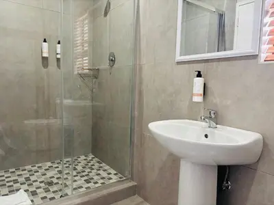 a bathroom with a sink and a shower at 1 on Brandspruit in Secunda