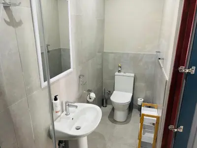a small bathroom with a sink and a toilet at 1 on Brandspruit in Secunda