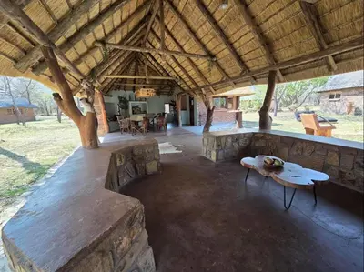 a pavilion with a table in the middle of a room at LoWes Africa in Vaalwater