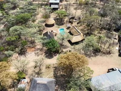 an overhead view of a backyard with a pool and trees at LoWes Africa in Vaalwater