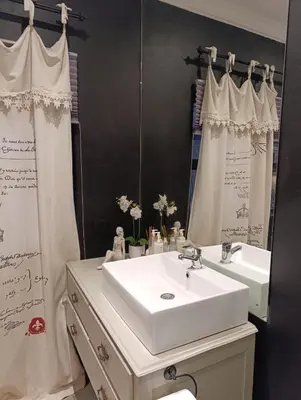 a bathroom with a white sink and a mirror at Net 'n Bed in Middelburg