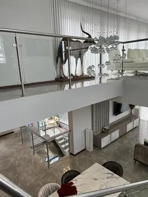 a living room with a table and a couch at Alimu villa in Nelspruit