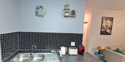 a kitchen with a sink and a counter top at Convenient Corner of GreenValley estate in Nelspruit