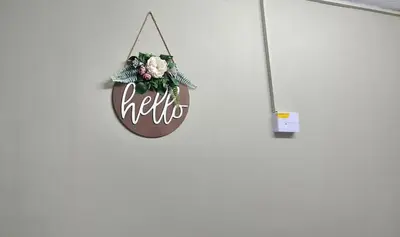 a sign that says hello hanging on a wall at Closer to CBD by UrbanCove in Nelspruit