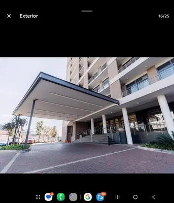 a large building with awning in front of it at Brown, Warm and Cozy, Menlyn Maine Residences 926 in Pretoria