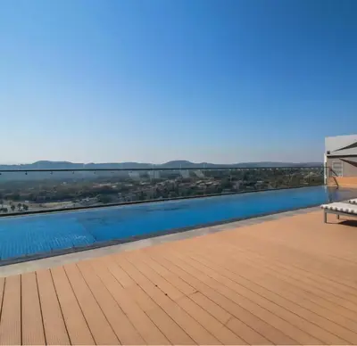 a view from the roof of a house with a swimming pool at Green Serene Studio, Menlyn Maine Residences 826 in Pretoria