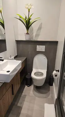 a bathroom with a toilet and a sink at Green Serene Studio, Menlyn Maine Residences 826 in Pretoria