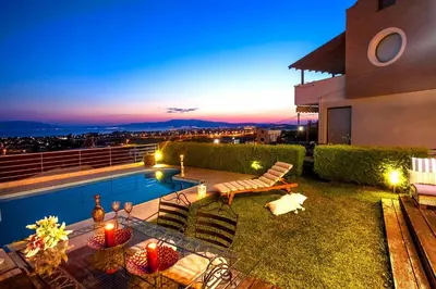 a backyard with a swimming pool at night at luucole the palm in Thohoyandou