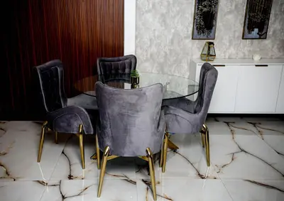 a dining room with a glass table and chairs at Beyond Borders Guest House in Polokwane