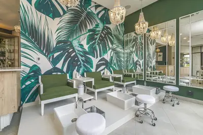 a salon with green and white chairs and a tropical mural at Staycation At Munyaka Estate in Midrand