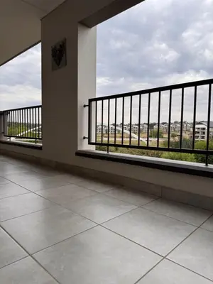 an empty balcony with a view of a city at Staycation At Munyaka Estate in Midrand