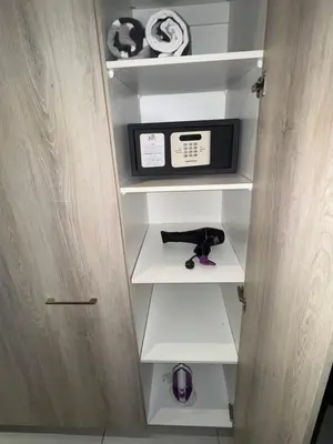 a kitchen with a cabinet with a microwave in it at Menlyn Maine Residences 811 in Pretoria