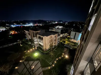 an aerial view of a city at night at Menlyn Maine Residences 811 in Pretoria