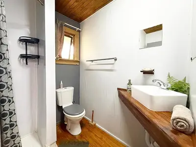 a bathroom with a white toilet and a sink at Elephant 1 Chalet Hippo Waterfront Lodge in Nelspruit