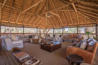 a large living room with couches and a large wooden ceiling at Karongwe - Chisomo Safari Camp in Hoedspruit