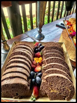 two slices of bread with fruit on a table at Karongwe - Chisomo Safari Camp in Hoedspruit