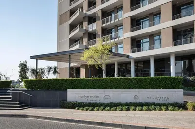 a building with a sign in front of it at Menlyn Maine Residences 813 in Pretoria