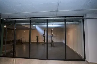 a room with sliding glass doors in a building at Spacious Fully Equipped Studio - Peaceful-Free WiFi in Pretoria