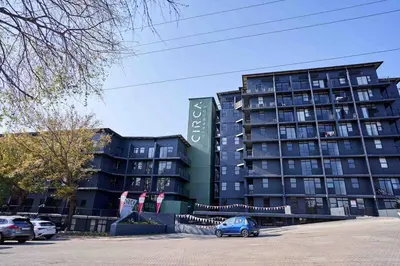 a blue car parked in front of a building at Spacious Fully Equipped Studio - Peaceful-Free WiFi in Pretoria
