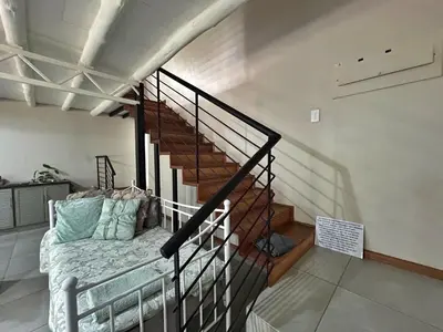 a room with a staircase with a bed in it at Grace541 in Pretoria