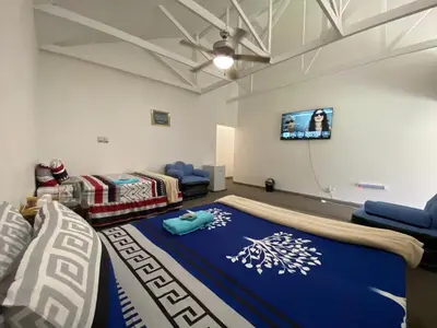 a living room with a bed and a flat screen tv at Fiet Star in Midrand