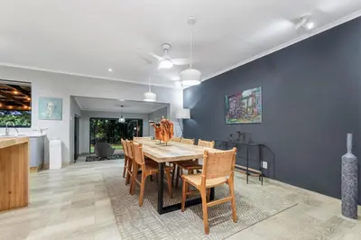 a dining room with a table and chairs at Bird of Paradise in Tzaneen