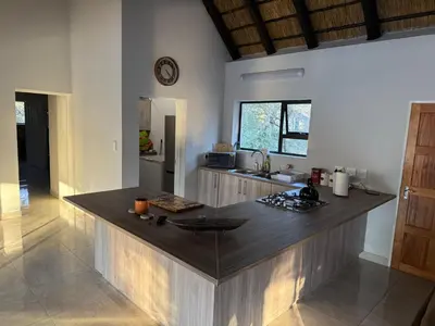 a kitchen with a large island in a room at Elephant Rest in Marloth Park