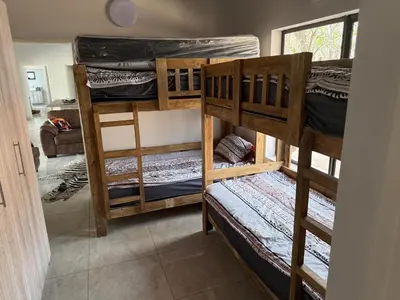 a group of bunk beds in a room at Elephant Rest in Marloth Park