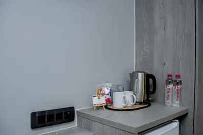 a kitchen with a counter top with appliances on it at Khayalami Hotel - Secunda in Secunda