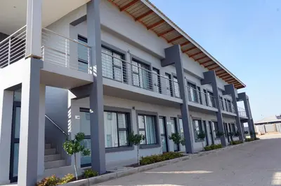 an external view of a building with balconies at Khayalami Hotel - Secunda in Secunda