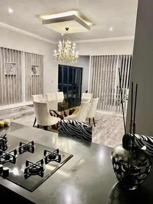 a living room with a stove and a dining room at oliphant private House in Midrand