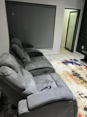 a gray couch sitting in a living room at oliphant private House in Midrand