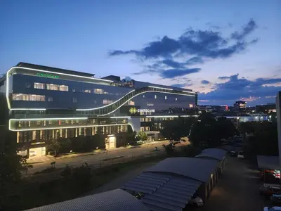 a large building with a walkway in front of it at Vista Retreat - Stylish Flat at Menlyn Main in Pretoria