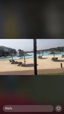 a view of a beach with tables and umbrellas at The Blyde Crystal Lagoon in Pretoria