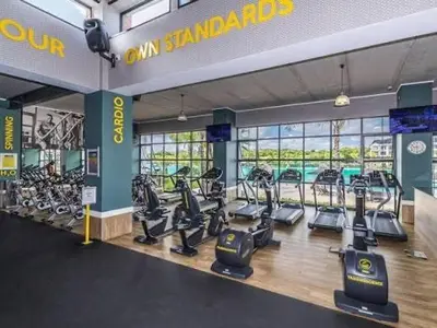 a gym with a bunch of treadms and cardio machines at The Blyde Crystal Lagoon in Pretoria