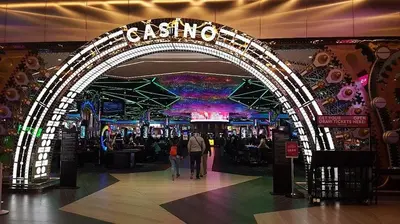 an archway in a mall with people walking through it at Luxury King Studio, Menlyn Maine, Time Square Views, Smart Access in Pretoria